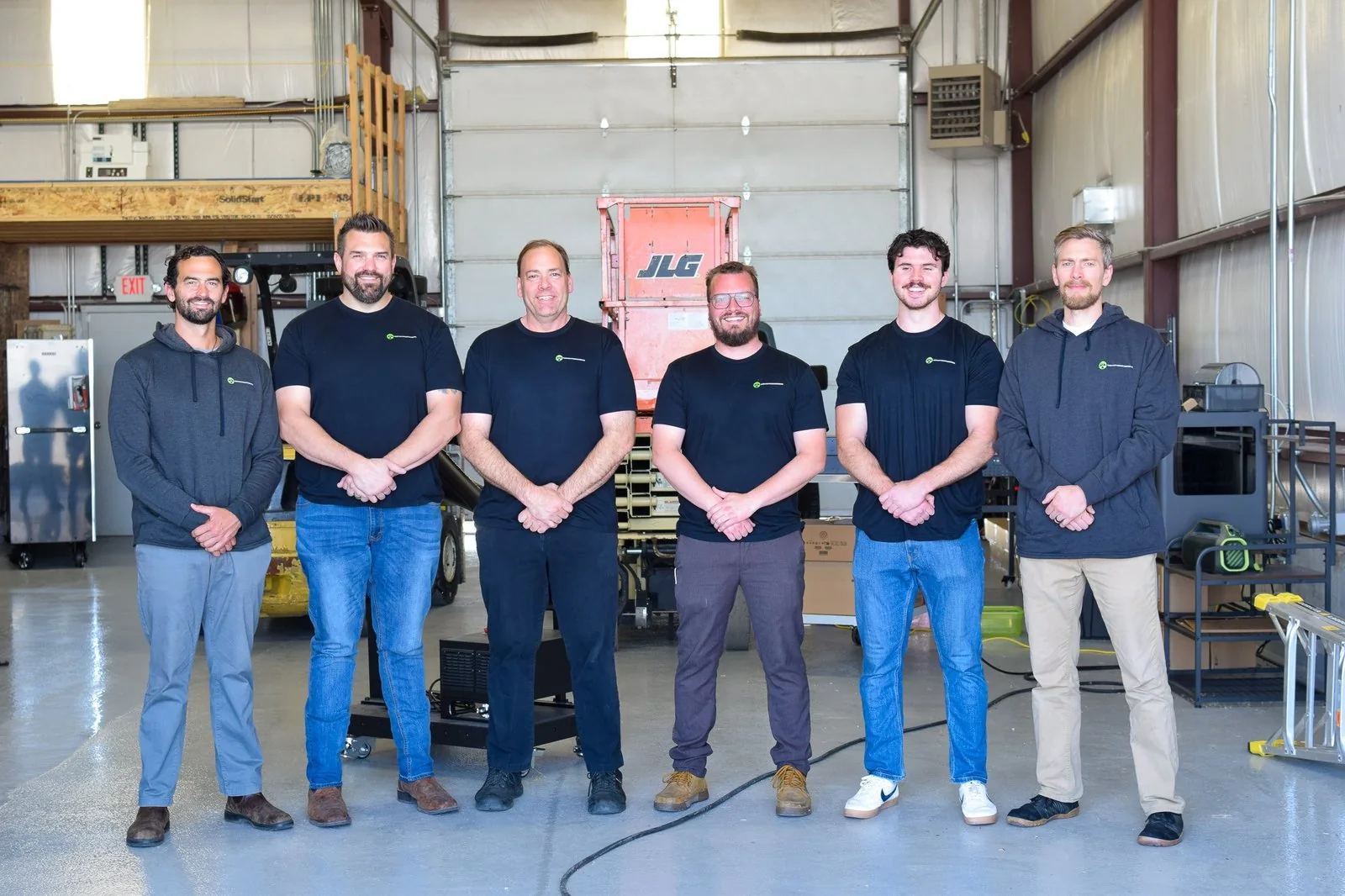 The Raven-Flint team standing in a row in the shop bay in Idaho Falls